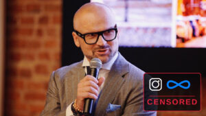 Rafał Brzoska mówi do mikrofonu, w rogu kadru znaki Instagrama i Mety z napisem CENSORED
