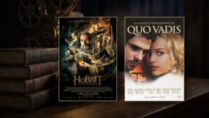 Plakaty Hobbita i Quo Vadis ustawione przed zabytkowym projektorem filmowym i stosem starych książek